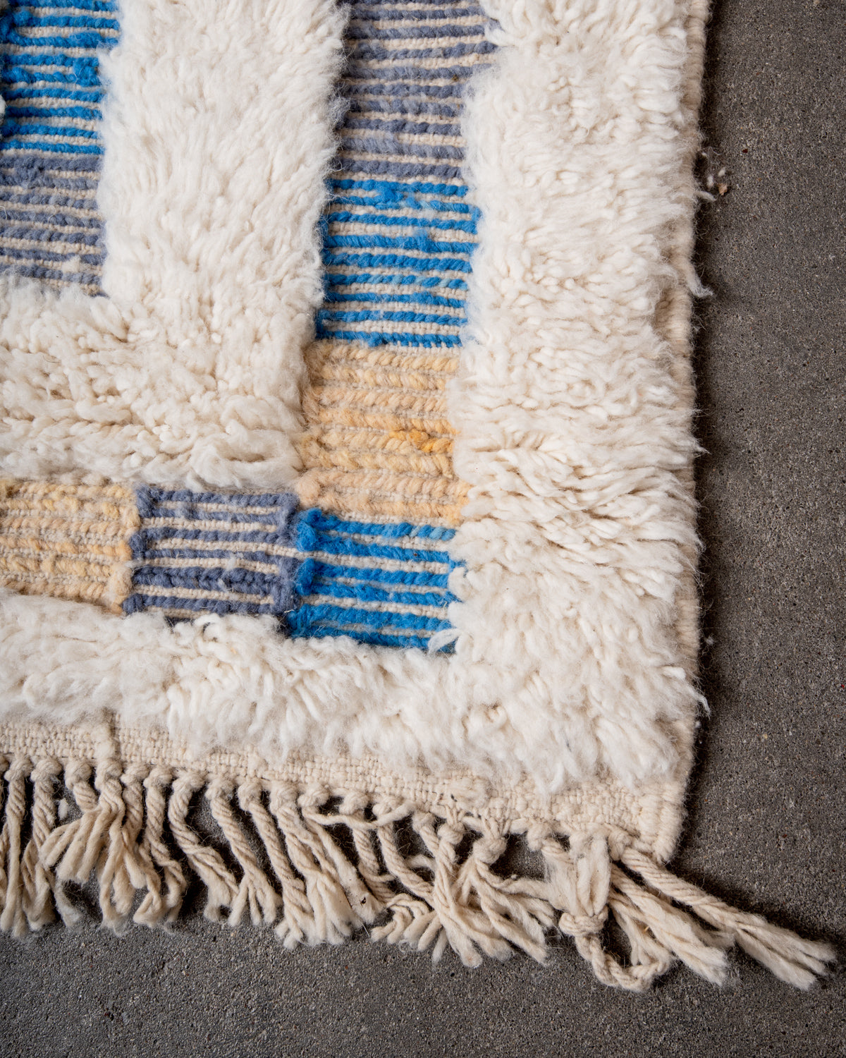 Modern, designer, handcrafted Berber rug from Morocco. Beniourain carpet with beautiful colours and patterns and fluffy wool texture.